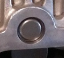 This shows the two variations of the Jaguar Eaton M112 Supercharger. The model on the left has protruding needle bearings that extend out past the sealing surface of the supercharger inlet port. The Jaguar Eaton M112 on the right has sub-flush needle bearings that are below the sealing surface of the supercharger in order to provide clearance where the inlet bolts on. These two superchargers are not interchangable because the protruding bearings will prevent proper installation of the Jaguar inlet plenum. The needle bearings are different diameters with the protruding needle bearings being a much larger diameter. The sub-flush needle bearings replacement is  included in the Jaguar Eaton Complete Supercharger Rebuild Service.