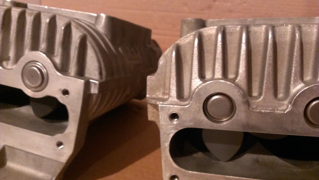 This shows the two variations of the Jaguar Eaton M112 Supercharger. The model on the left has protruding needle bearings that extend out past the sealing surface of the supercharger inlet port. The Jaguar Eaton M112 on the right has sub-flush needle bearings that are below the sealing surface of the supercharger in order to provide clearance where the inlet bolts on. These two superchargers are not interchangable because the protruding bearings will prevent proper installation of the Jaguar inlet plenum. The needle bearings are different diameters with the protruding needle bearings being a much larger diameter. The sub-flush needle bearings replacement is  included in the Jaguar Eaton Complete Supercharger Rebuild Service.
